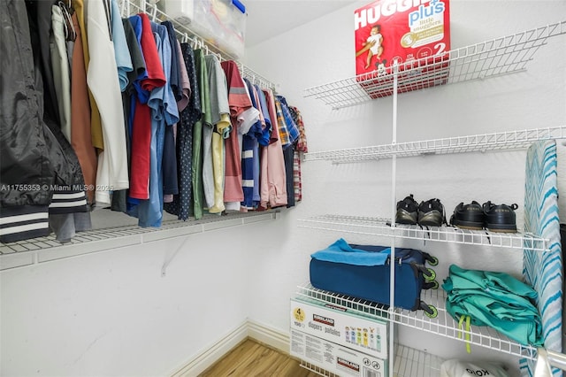 spacious closet with wood finished floors