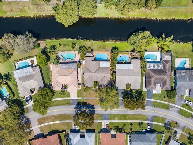 drone / aerial view with a water view