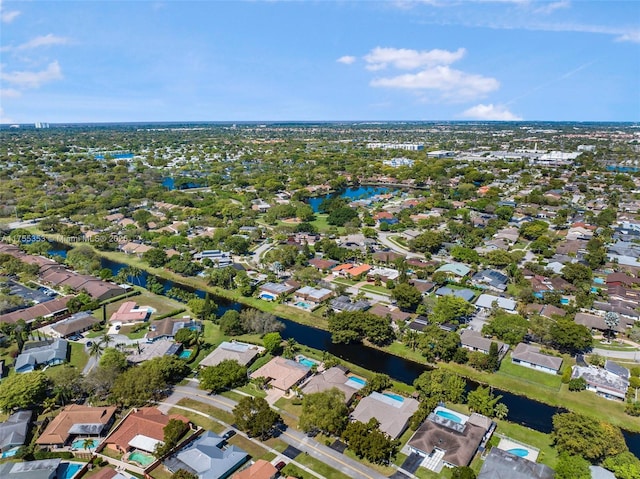 birds eye view of property featuring a water view and a residential view
