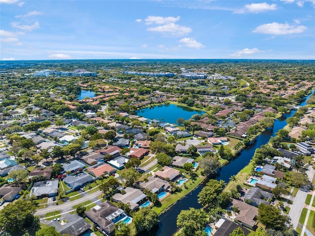 drone / aerial view featuring a water view and a residential view