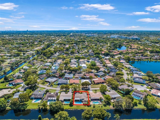 bird's eye view with a residential view and a water view