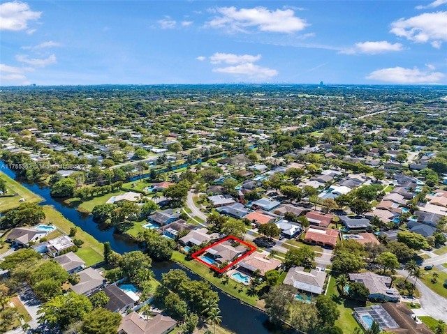 birds eye view of property featuring a water view and a residential view