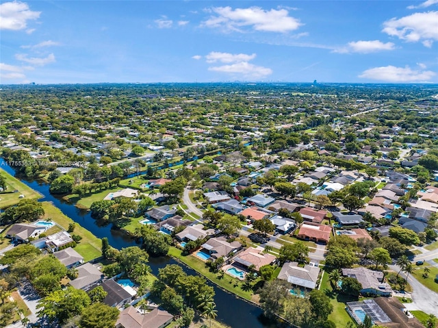 drone / aerial view with a residential view and a water view