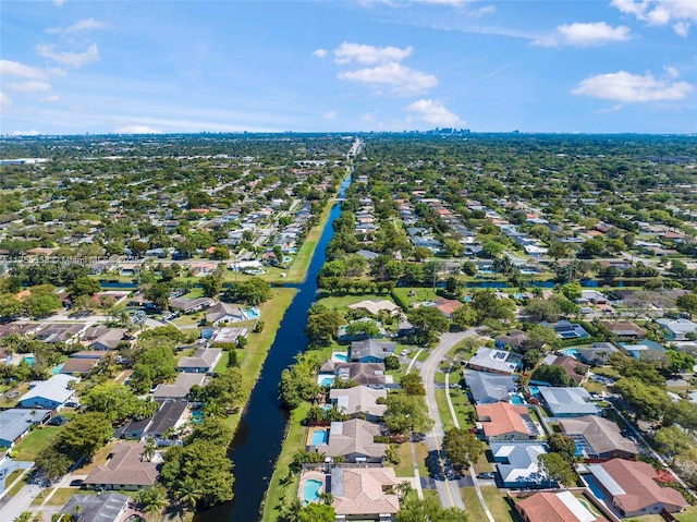 birds eye view of property with a water view and a residential view
