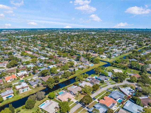 bird's eye view featuring a residential view and a water view