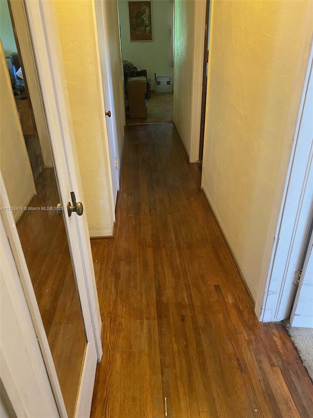 hall with dark wood finished floors