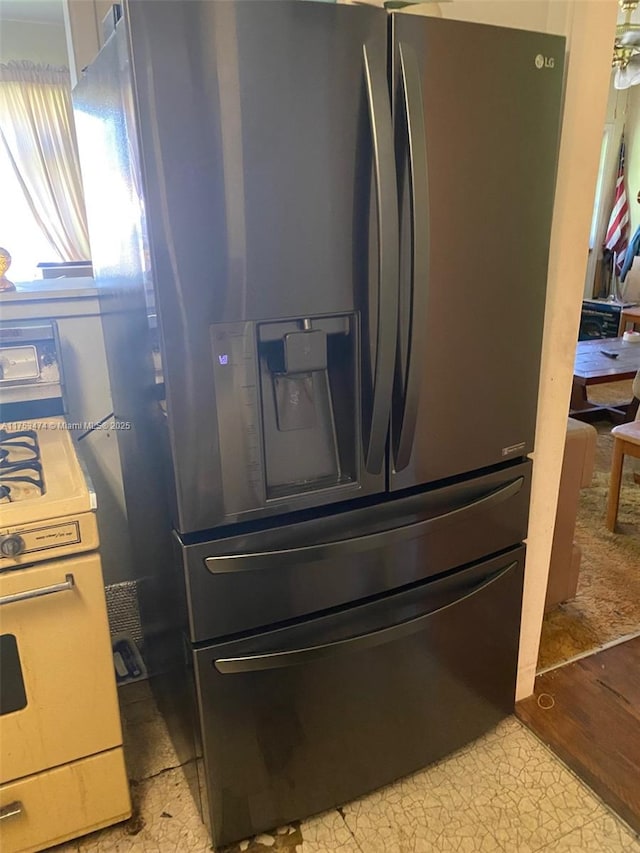 room details with double oven range and refrigerator with ice dispenser