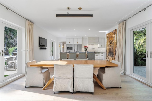 dining room featuring light wood-style flooring and recessed lighting