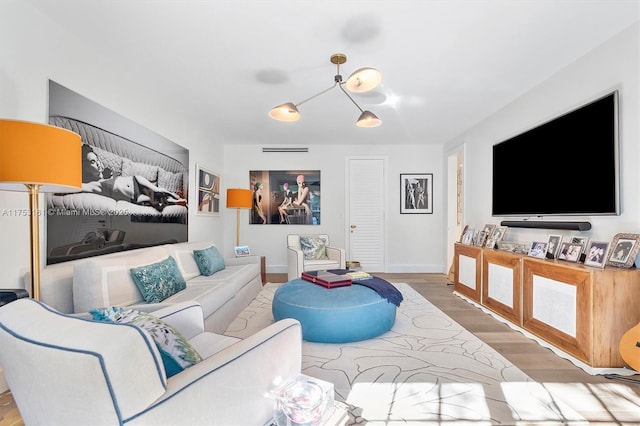 living room featuring wood finished floors and baseboards