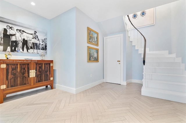 interior space featuring stairs and baseboards