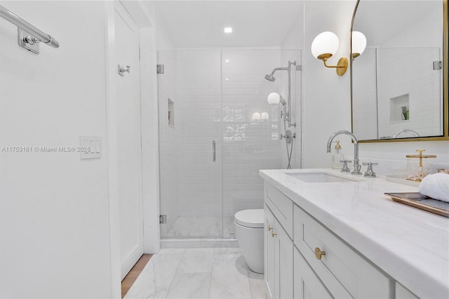 bathroom featuring marble finish floor, toilet, vanity, and a shower stall