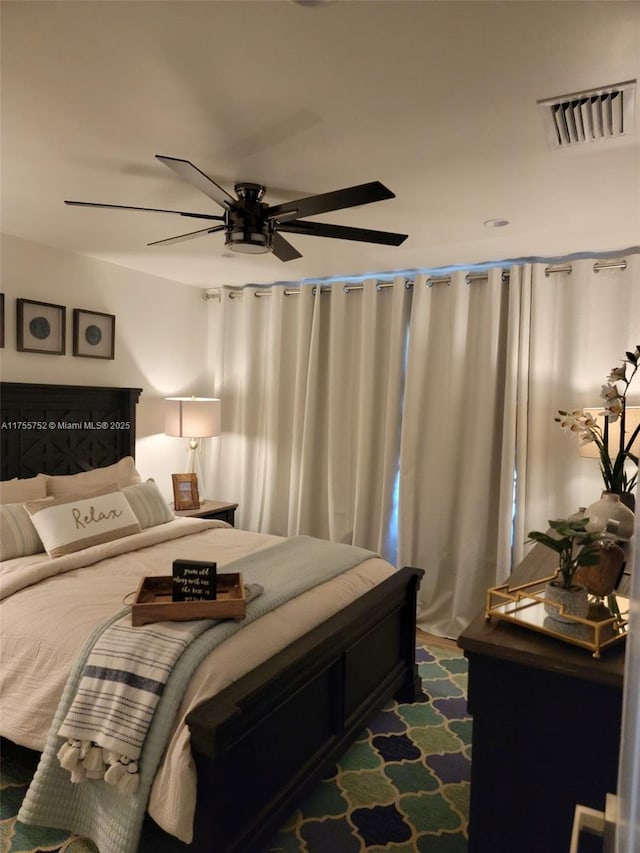 bedroom featuring visible vents and ceiling fan