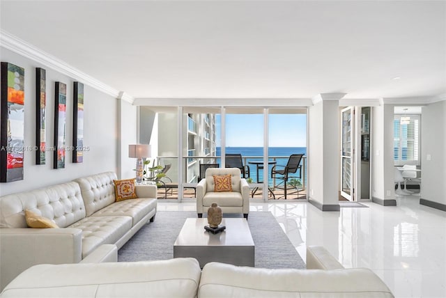 living room featuring baseboards, a wealth of natural light, crown molding, and a water view