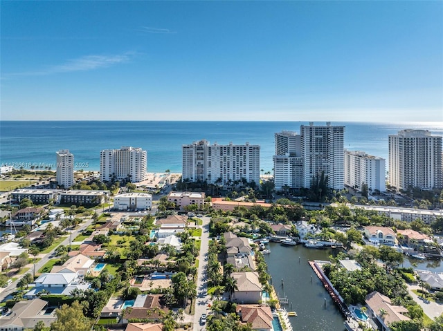 aerial view featuring a city view and a water view