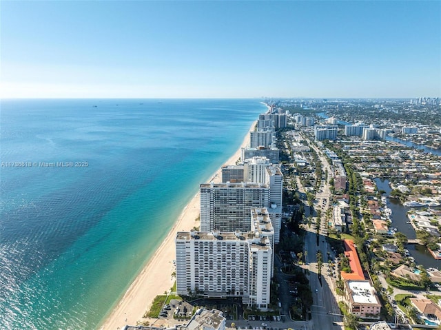 aerial view featuring a beach view, a city view, and a water view