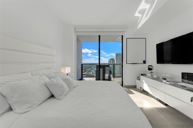 68 SE 6th St Unit 3506, Miami, FL 33131 - bedroom featuring access to outside and expansive windows