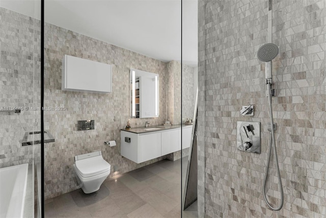 68 SE 6th St Unit 3506, Miami, FL 33131 - bathroom featuring vanity, a tile shower, toilet, and tile walls