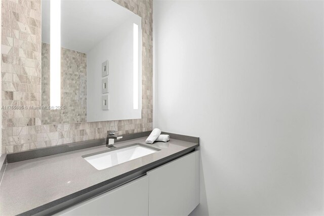 68 SE 6th St Unit 3506, Miami, FL 33131 - bathroom featuring backsplash and vanity