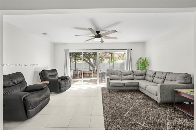 tiled living room featuring a ceiling fan