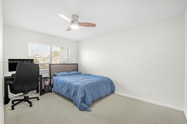 carpeted bedroom featuring a ceiling fan and baseboards