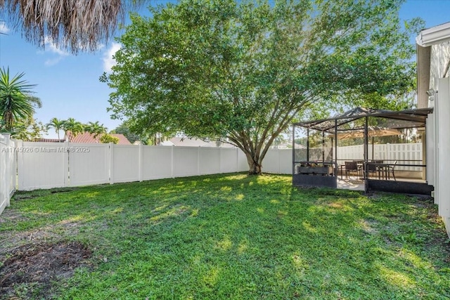 view of yard with a patio area and a fenced backyard