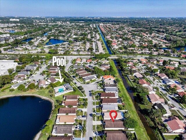 bird's eye view featuring a water view and a residential view