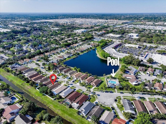 birds eye view of property featuring a water view and a residential view