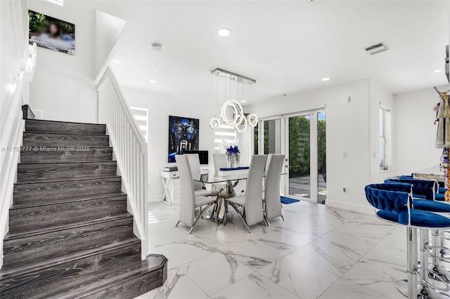 dining space featuring baseboards, visible vents, marble finish floor, stairs, and recessed lighting