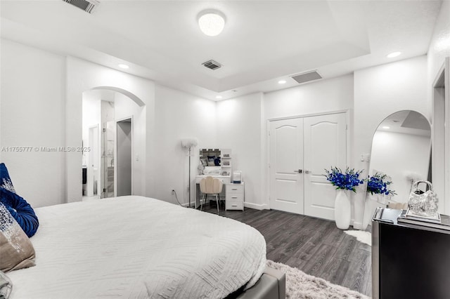 bedroom featuring dark wood-type flooring, recessed lighting, and visible vents