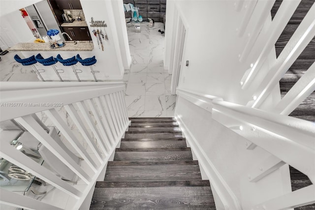 stairway with marble finish floor