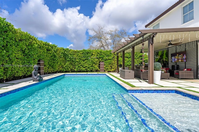 pool featuring ceiling fan, outdoor lounge area, and a patio