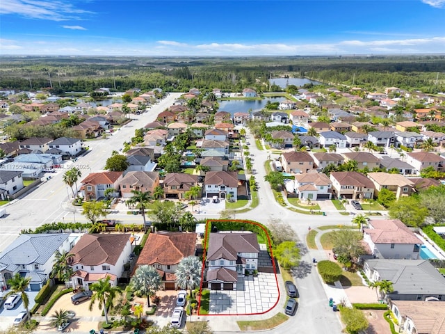 birds eye view of property featuring a residential view and a water view