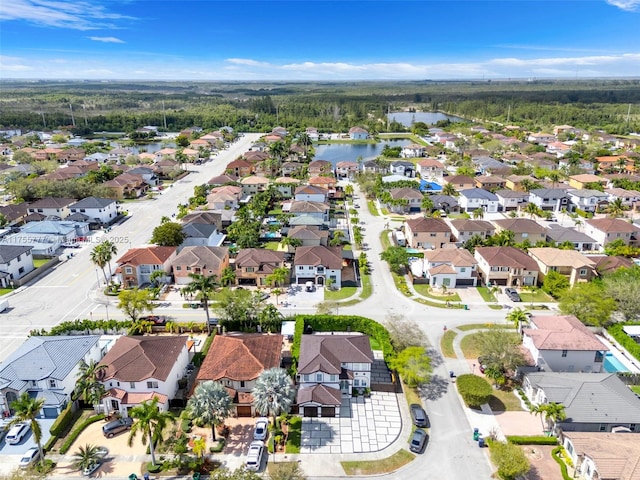 bird's eye view with a water view and a residential view