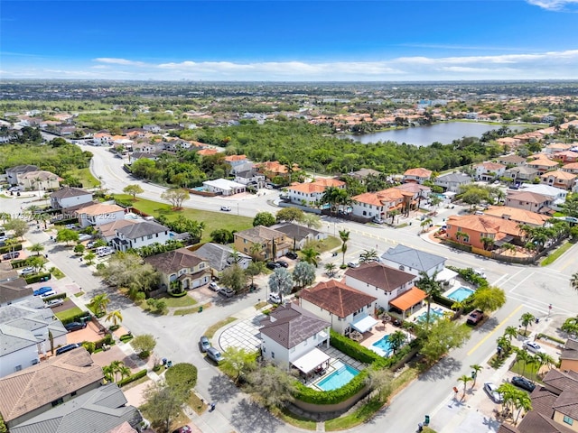 bird's eye view with a water view and a residential view