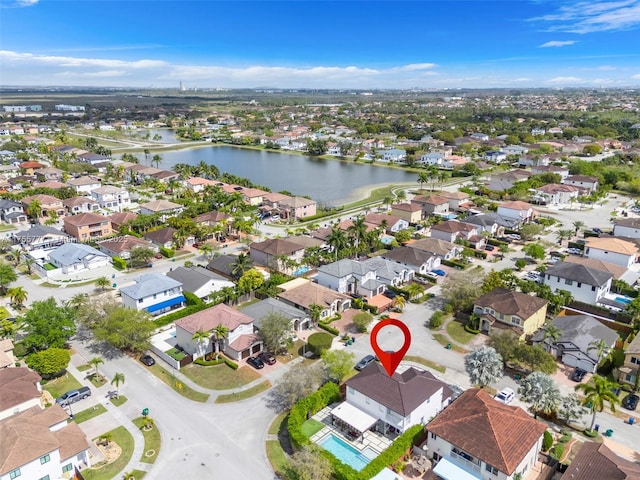 aerial view featuring a water view and a residential view