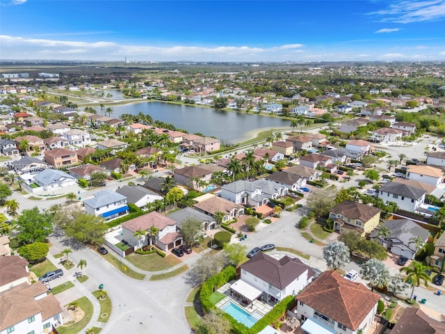 birds eye view of property featuring a water view and a residential view