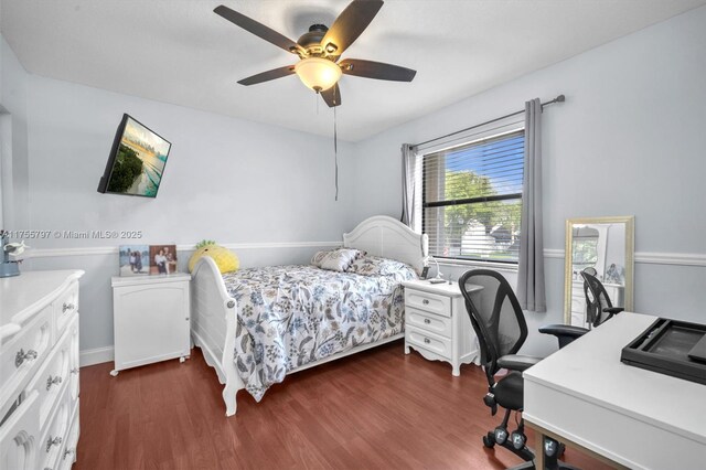 bedroom featuring ceiling fan and dark wood finished floors