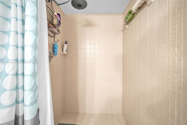 full bath with a tile shower