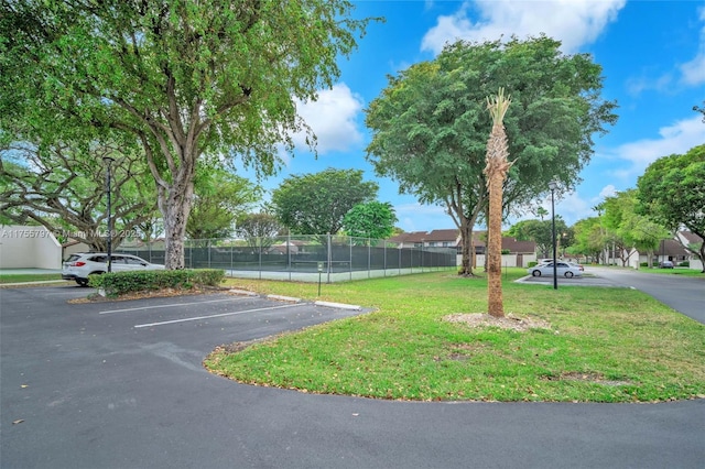 uncovered parking lot with fence