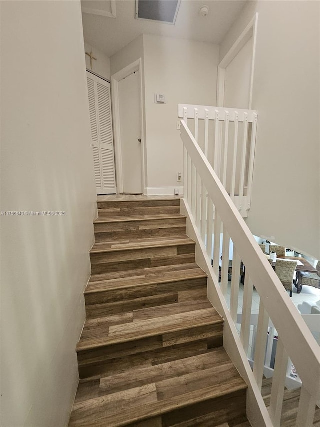 stairs with wood finished floors