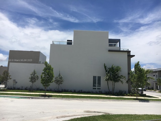 view of home's exterior with stucco siding