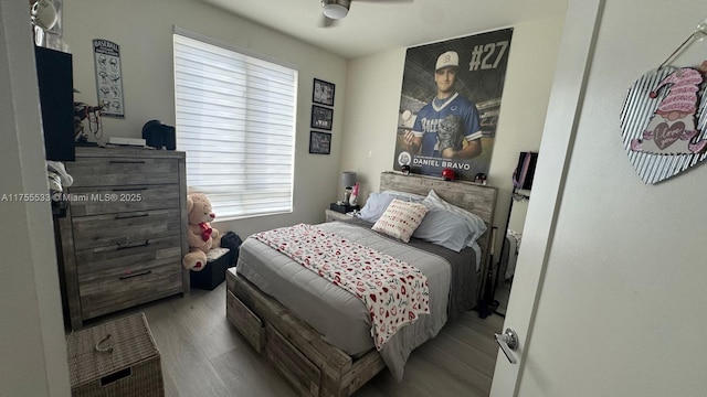 bedroom featuring ceiling fan and wood finished floors