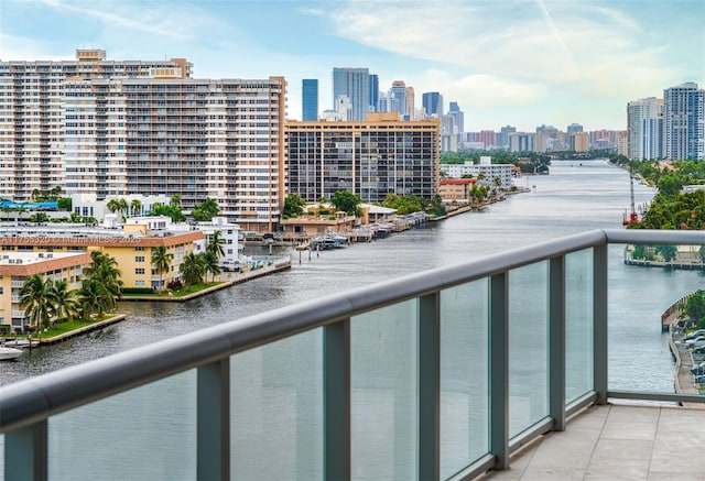 balcony with a view of city and a water view