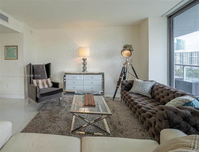 tiled living area with visible vents and baseboards