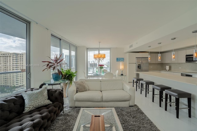 living area featuring light tile patterned floors and visible vents