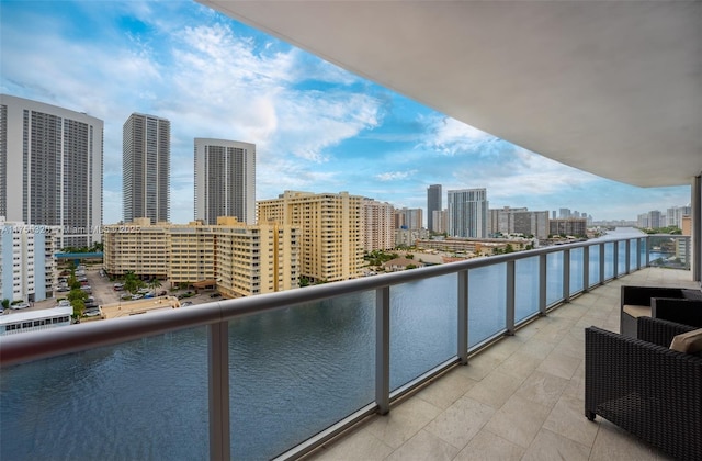 balcony with a city view and central air condition unit