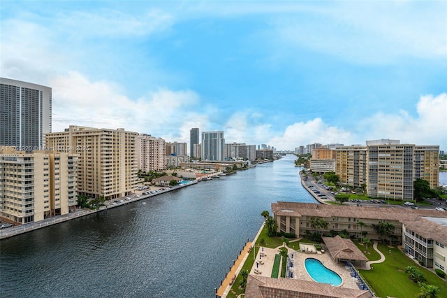 birds eye view of property featuring a view of city and a water view