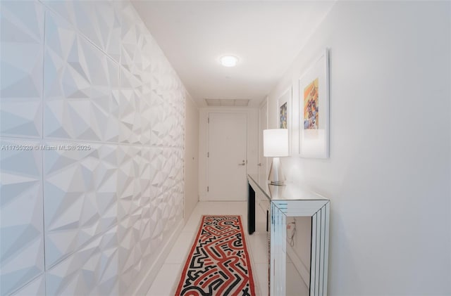 hall with light tile patterned floors and visible vents