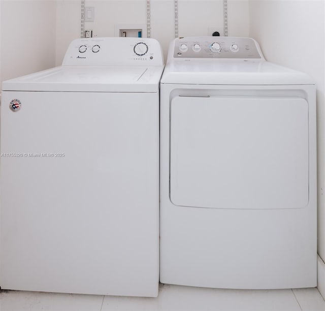 washroom with laundry area and washer and dryer