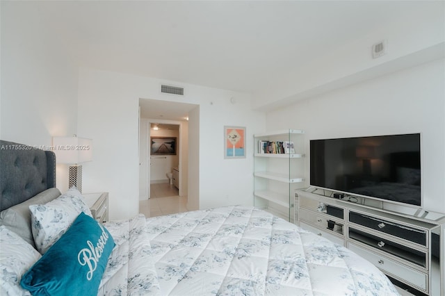 bedroom with tile patterned flooring and visible vents